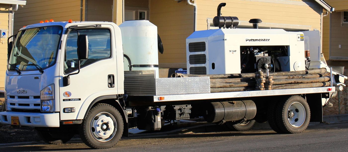 AAA Concrete Pumping truck-mounted line pump on a job site
