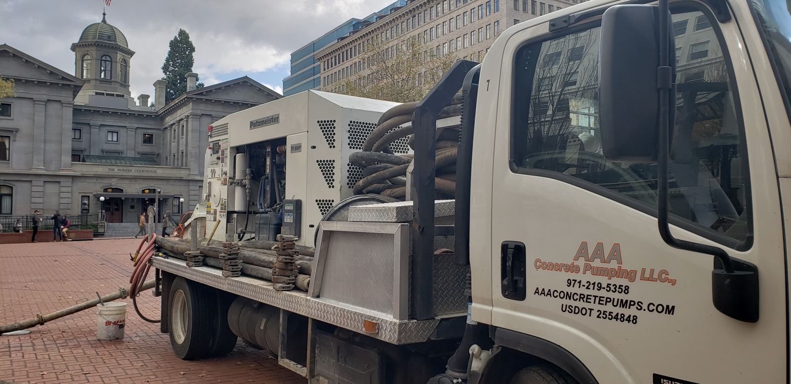 AAA Concrete Pumping truck-mounted line pump on a job site